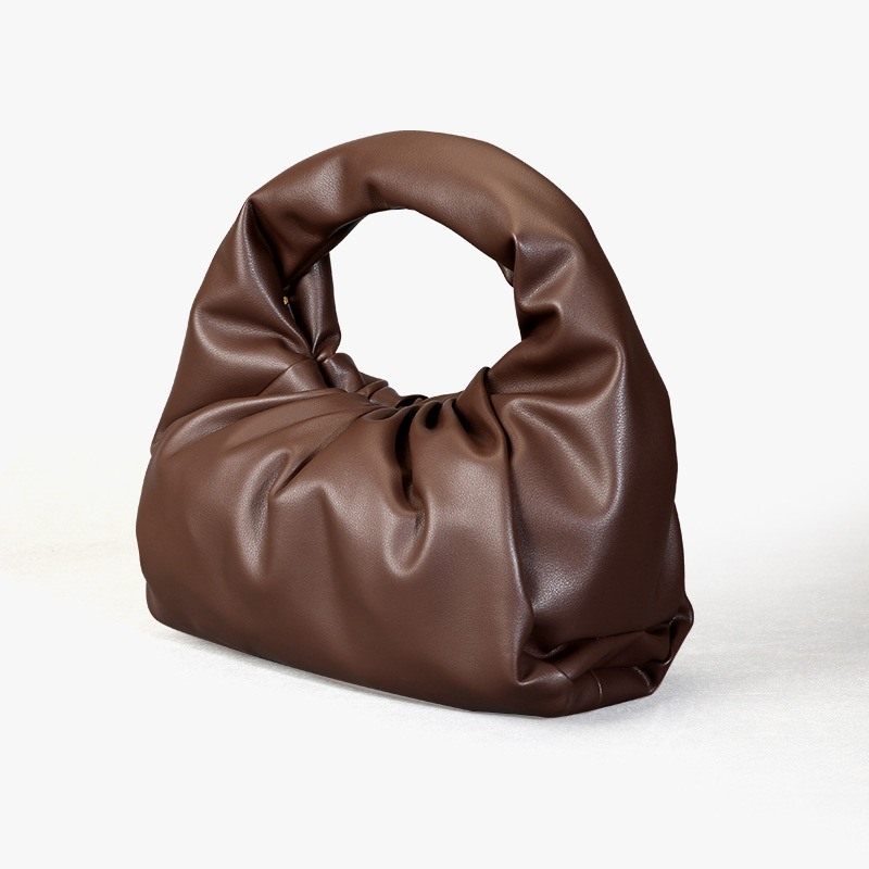 Simple hand carrying large capacity leather croissant