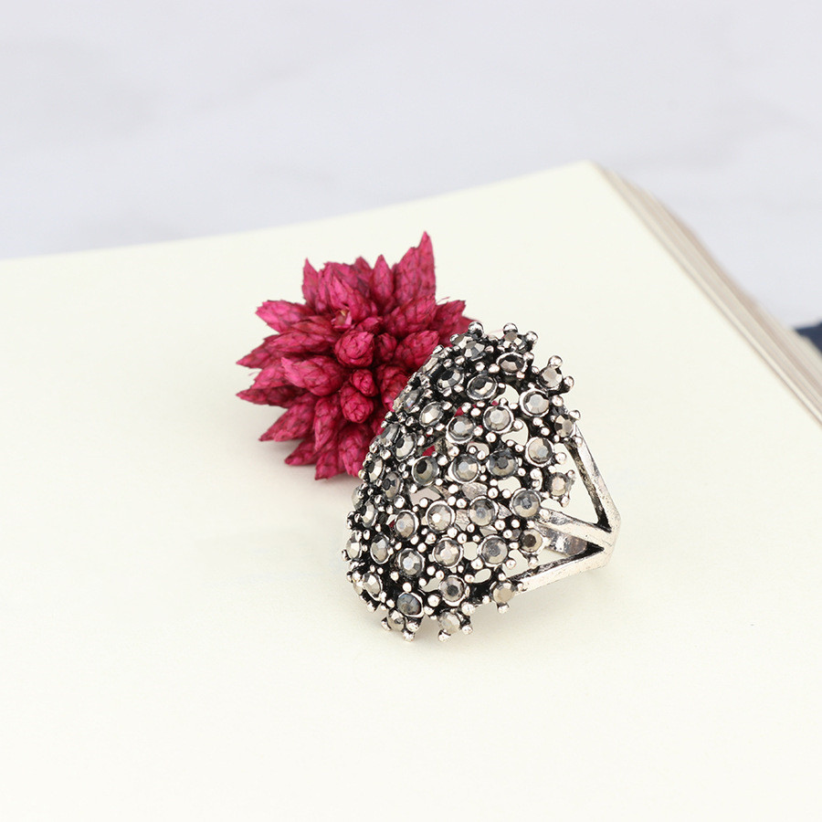 Dense four-prong black diamond ring — view 2