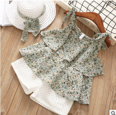 Two-piece suit of sling floral top and shorts