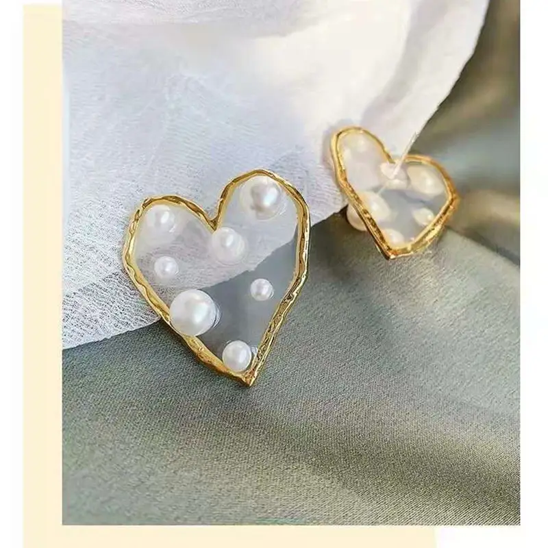 Pearl geometric stud earrings