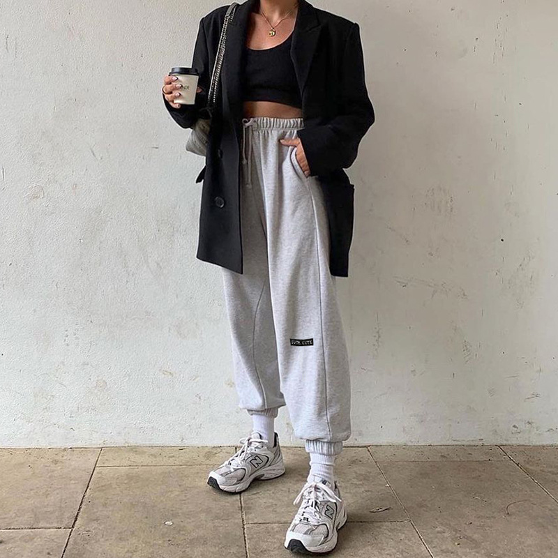 Sports sweatpants with small embroidered feet