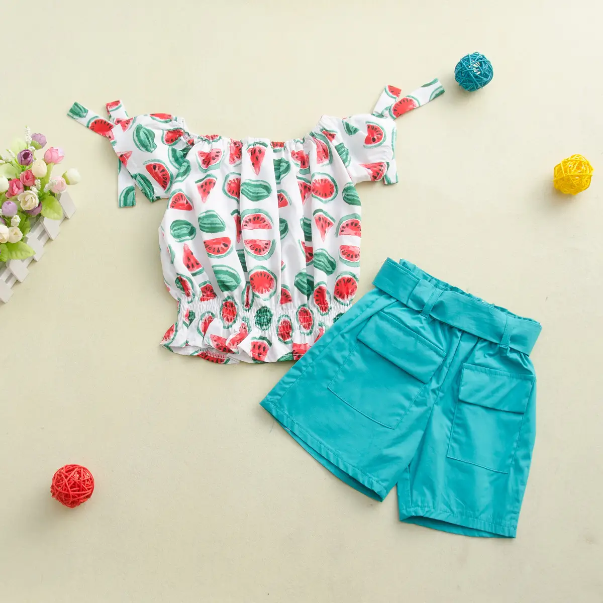Two-piece children's suit with solid color shorts