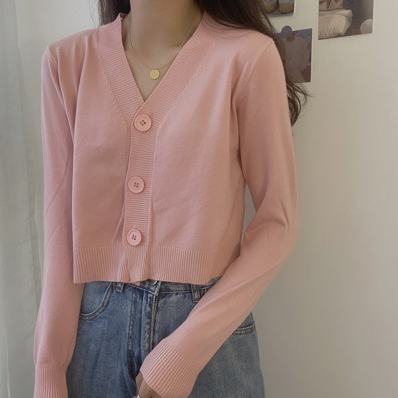 Wear a short sweater over a loose top