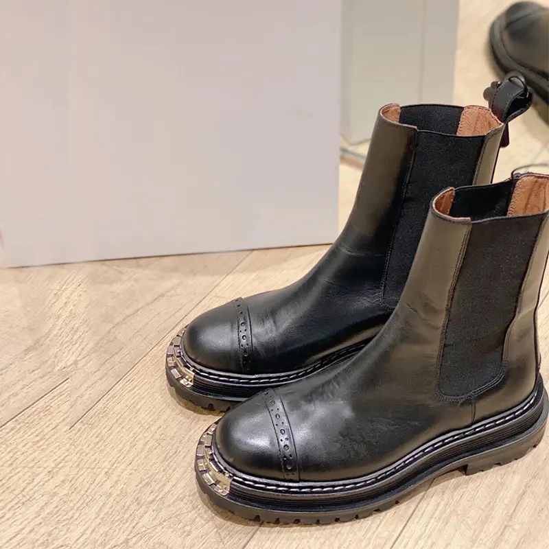 Boots with metal decoration