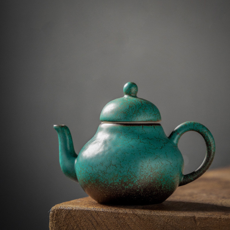 Ceramic handmade ball hole teapot kiln turned green
