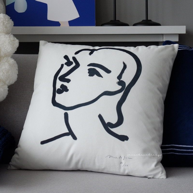 Round pillow head cushion b&B is wrapped in navy blue