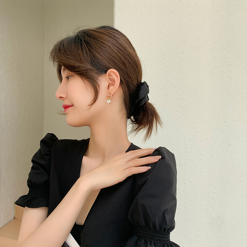 Twisted geometric white shell earrings