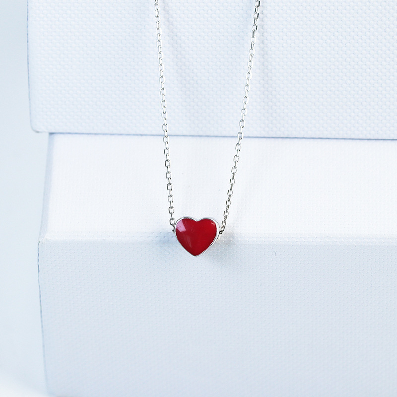 Discolored small red heart necklace
