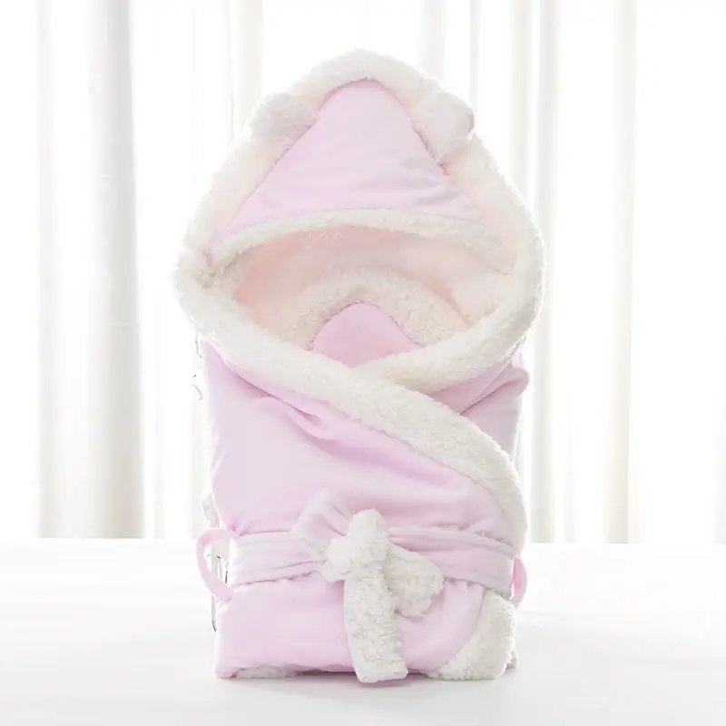 Newborn Baby Being Hugged and Swaddled by