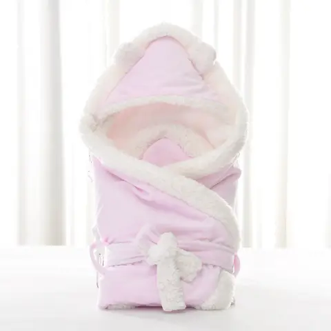 Newborn Baby Being Hugged and Swaddled by