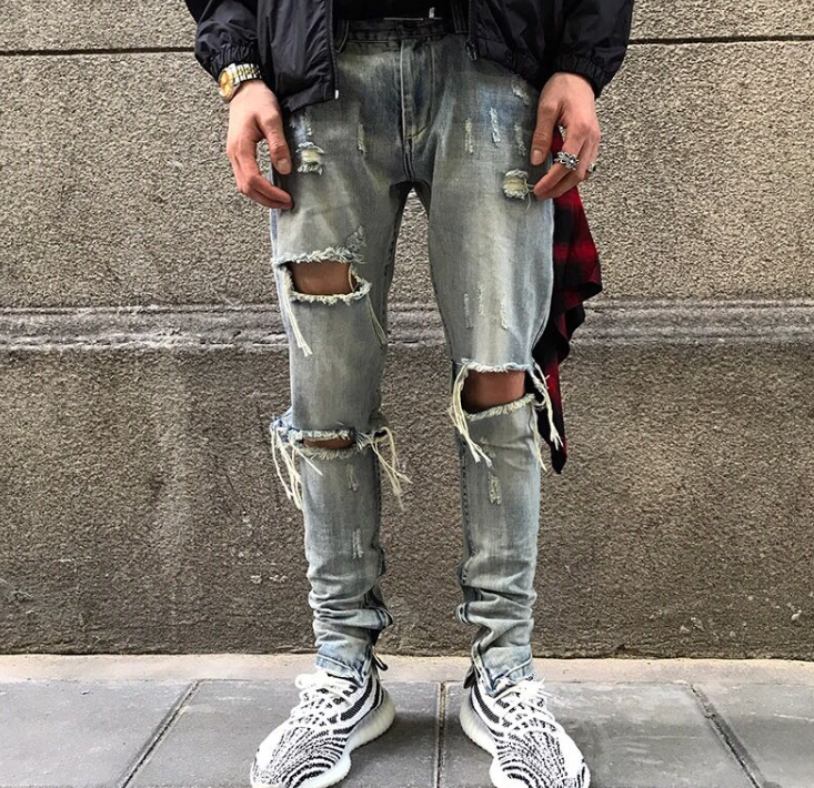 Washed holes in jeans, men and women GRE hip hop street trend stars with the same paragraph