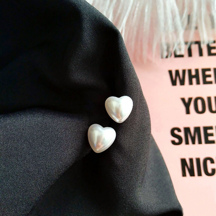 White glossy heart stud earrings