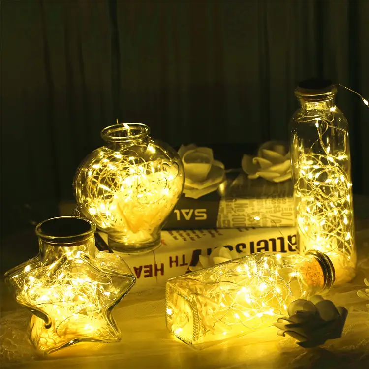 Glass bottle with gypsophila lights