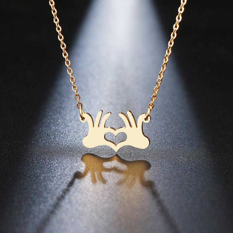 Stainless steel hand-than-heart personality pendant