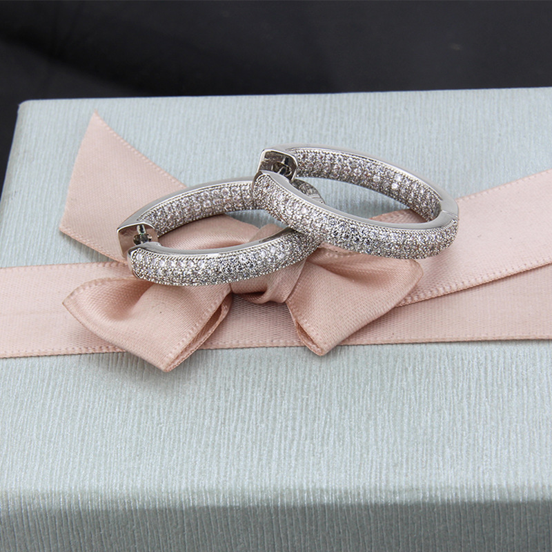 Three Rows Of Round Earrings With Zirconium Plating