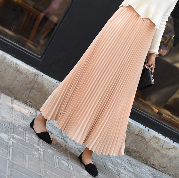 Title 18, Solid color pleated skirt offers effortless sty...