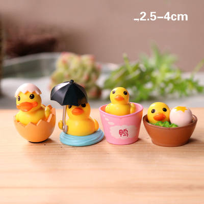 Set of four wooden ducklings