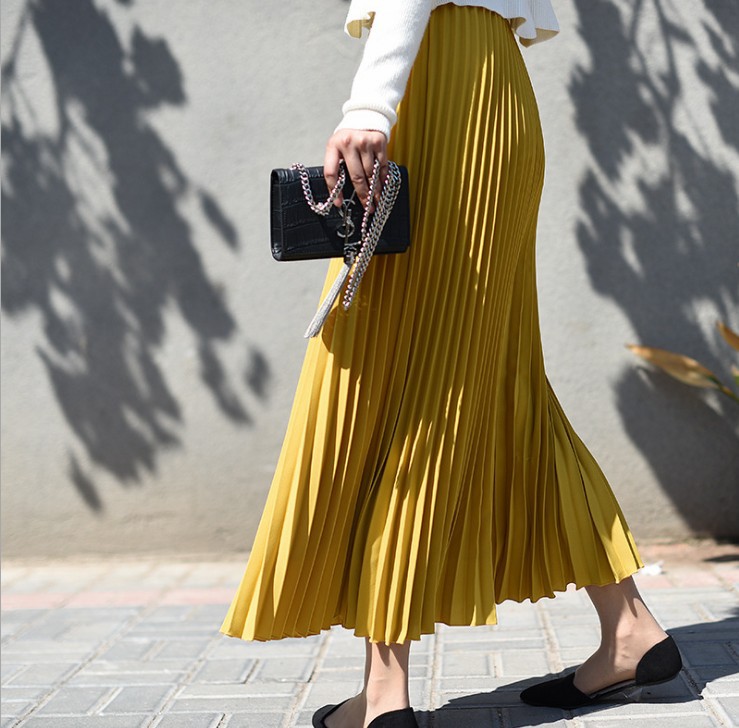 Title 17, Solid color pleated skirt offers effortless sty...