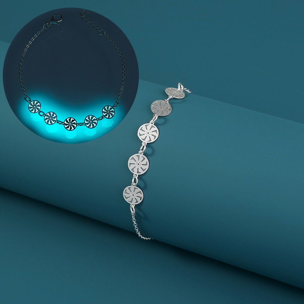 Cyclonic silver bracelet that glows in the dark.