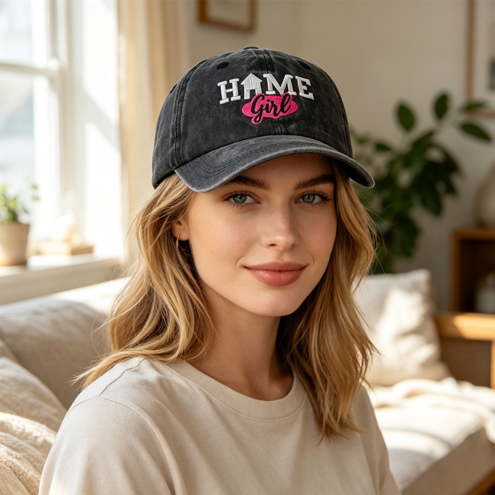 Vintage washed black baseball cap with HOME Girl embroidery – front view showing white and pink stitching