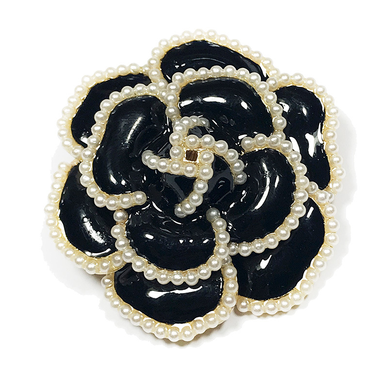 Title 5, Camellia brooch trinket