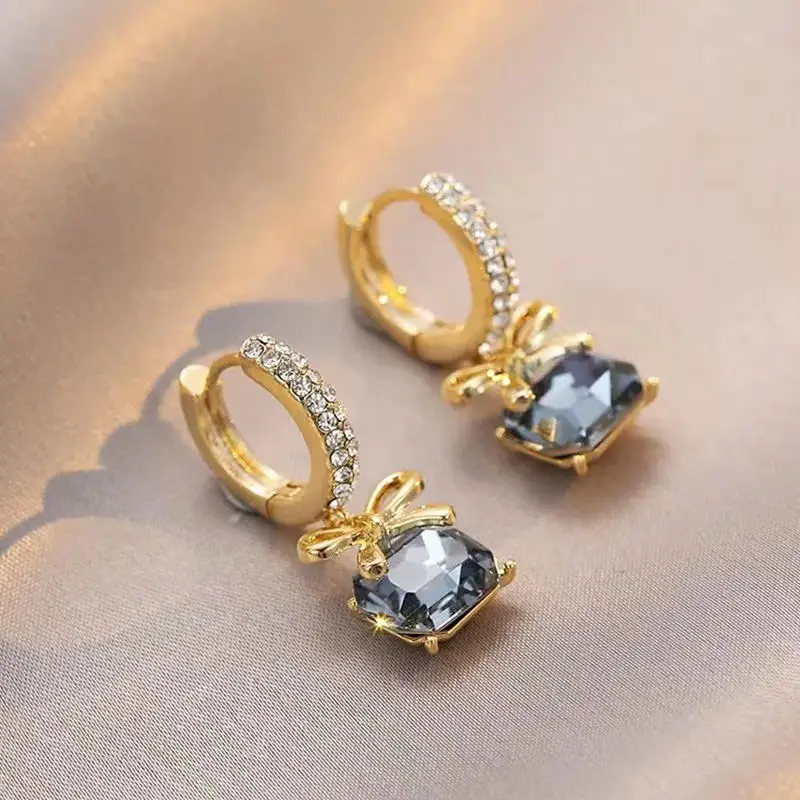 Crystal Bow Drop Earrings with Zircon Accents and Blue Stone