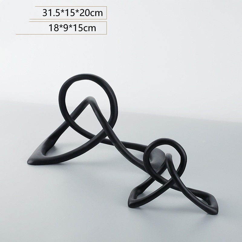 Title 3, Simple and modern black resin twisted knot abst...