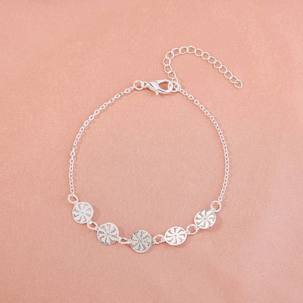 Cyclonic silver bracelet that glows in the dark.