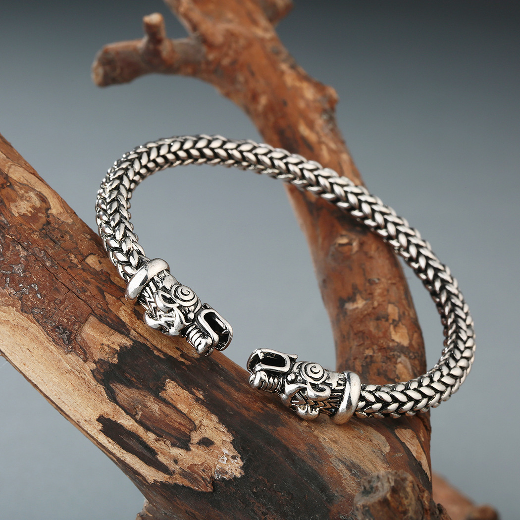 Asgard Crafted Small Handcrafted Stainless Steel Grey Wolf Head Torc Bracelet - Image of the bracelet crafted with stainless steel featuring a grey wolf head design.