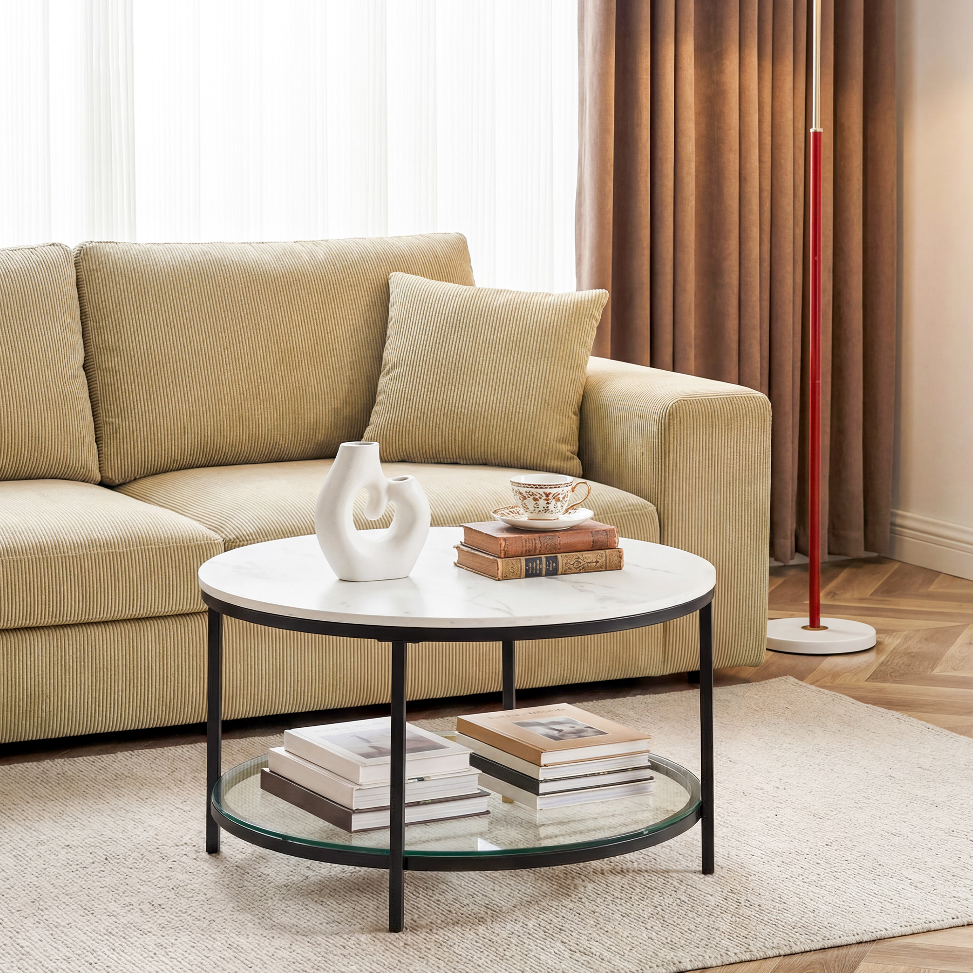 The Living Room Features A Marble Circular Glass Coffee Table, And A Double-layer Circular Transparent Coffee Table With Storage Function.