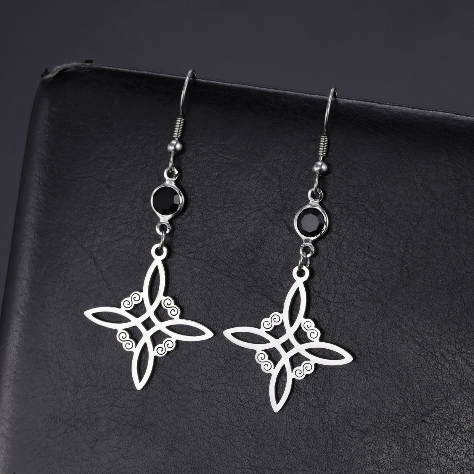 Title 4, Hollow-out symmetrical stainless steel earrings...