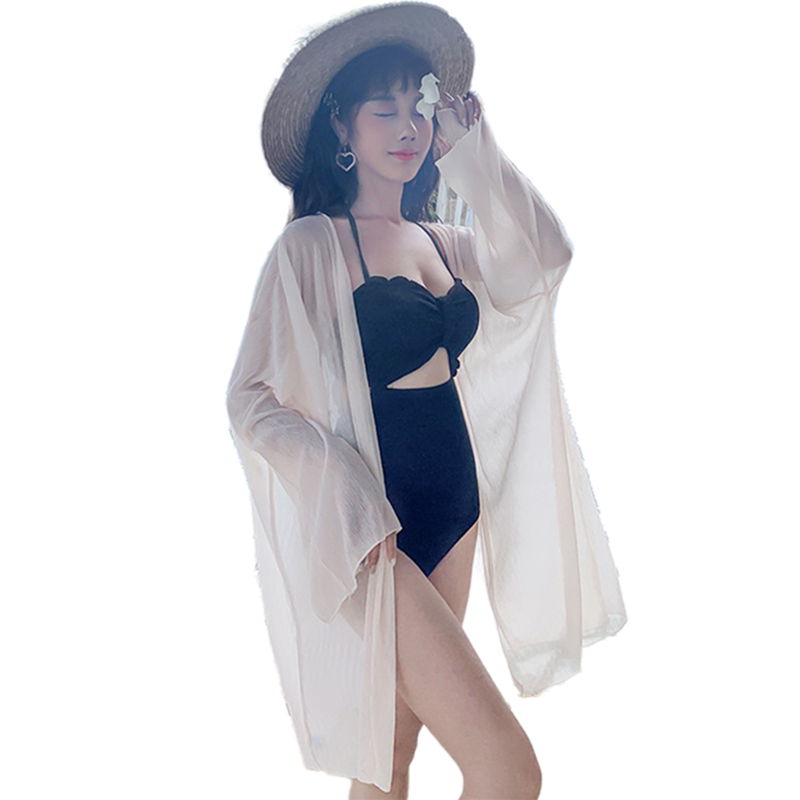 Swimsuit and apricot coat