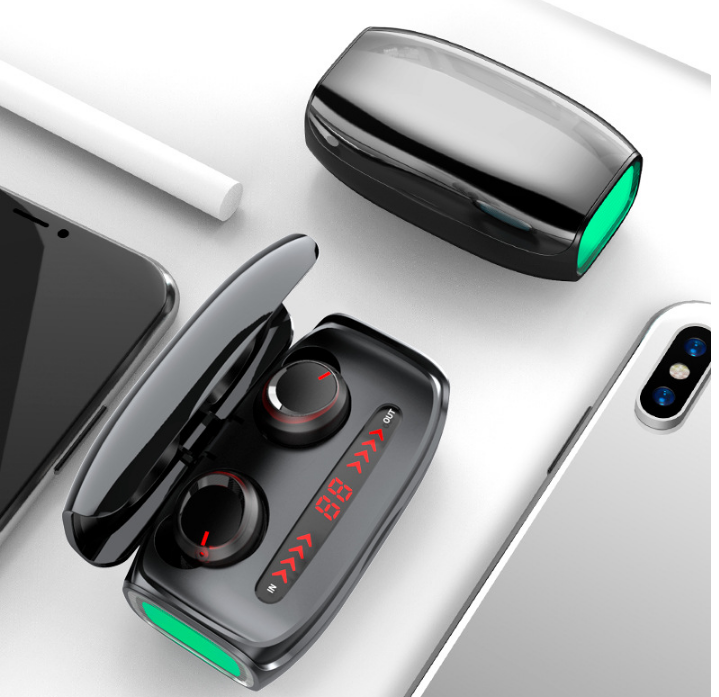 Compact wireless earbuds and charging case with green accents and LED battery indicator, perfect for on-the-go use