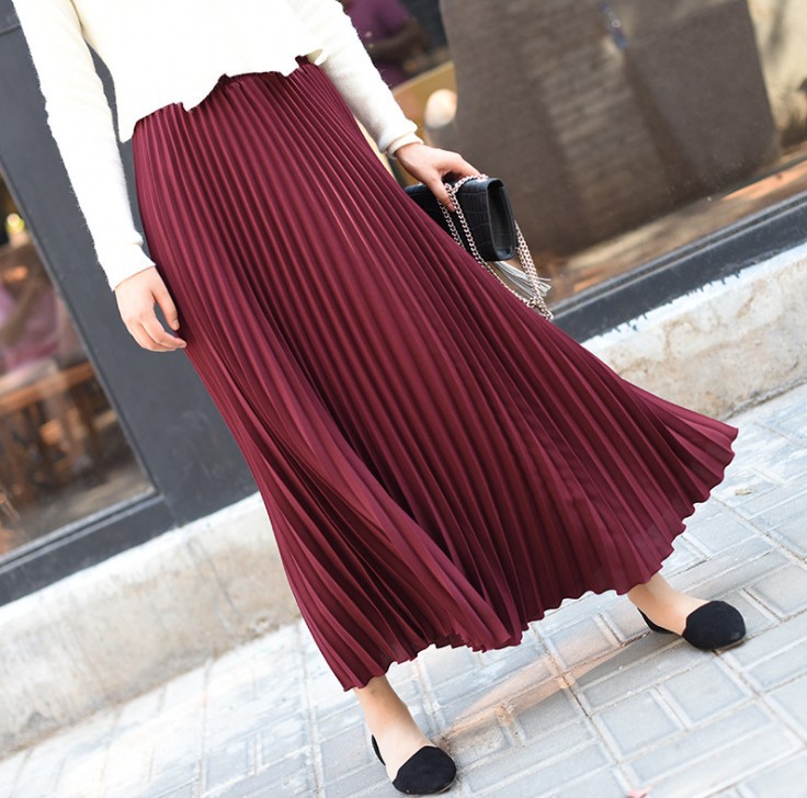 Title 14, Solid color pleated skirt offers effortless sty...