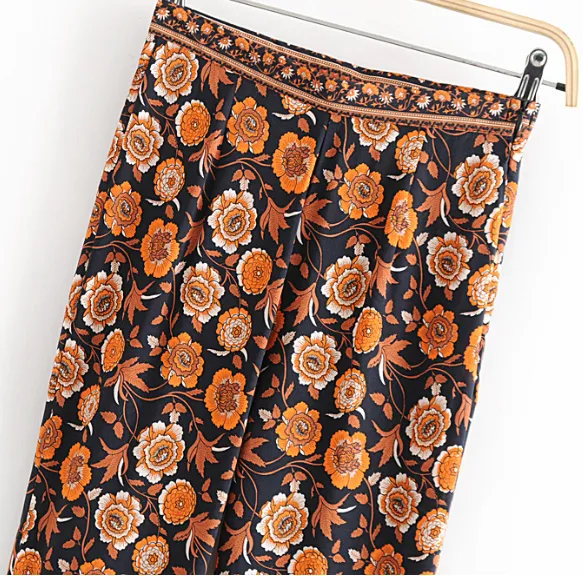 Women's New Positioning Flower Black Flower Flared Trousers Yellow - Shop at LoveMi