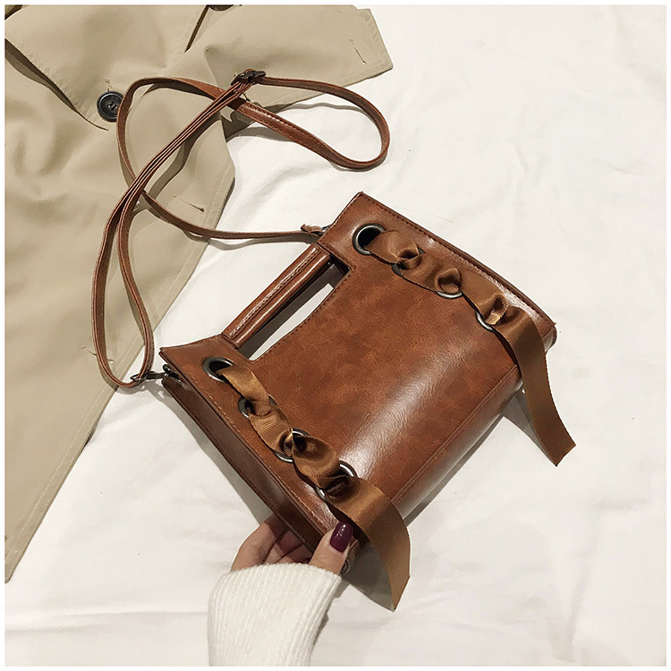 Title 15, Small square oilskin bag with silk scarf. Daily...