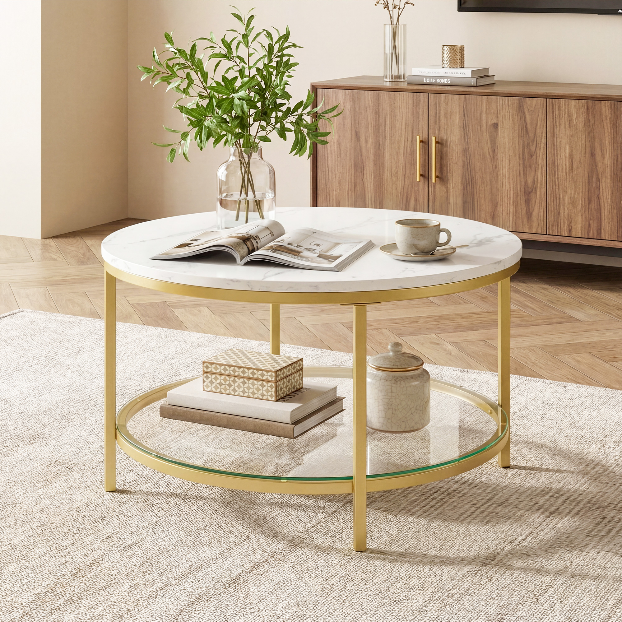 The Living Room Features A Marble Circular Glass Coffee Table, And A Double-layer Circular Transparent Coffee Table With Storage Function.