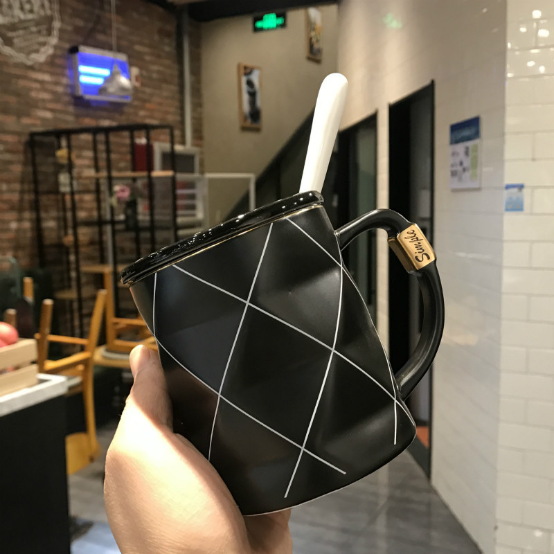 Gold painted black and white lattice ceramic cup