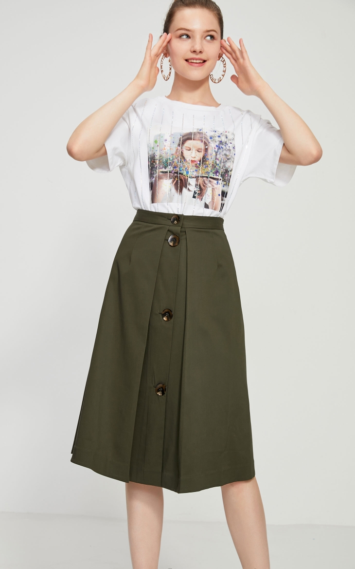 Title 10, Button embellished pleated A-line skirt, a styl...