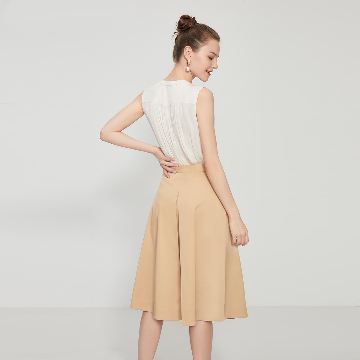 Title 3, Button embellished pleated A-line skirt, a styl...