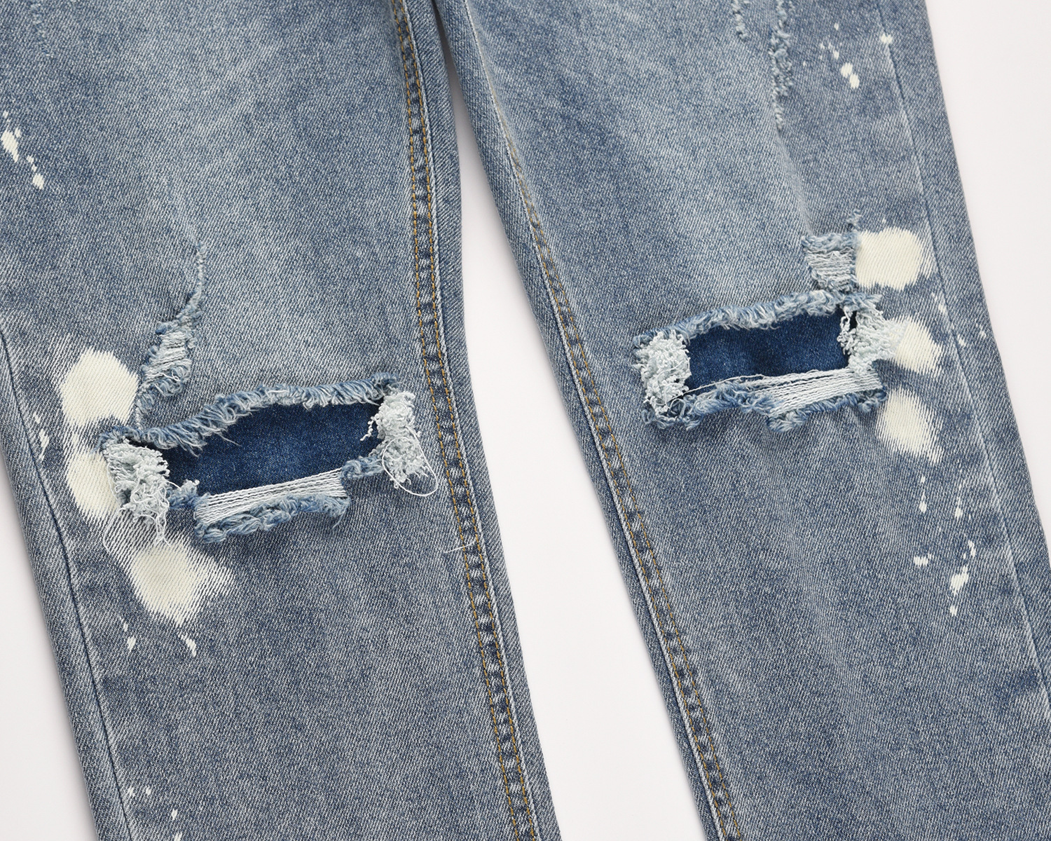 Light Blue Jeans With Splashed Ink And Ripped Elastic Wash