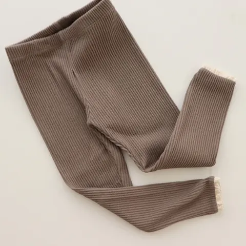 Babies and Girls Wear Leggings Over Autumn Trousers