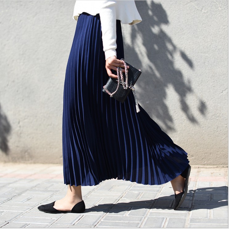 Title 4, Solid color pleated skirt offers effortless sty...