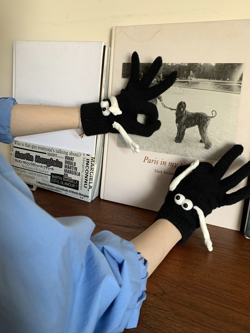 Hand Holding Gloves Black