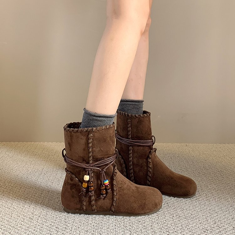 Women's suede boots – brown color lifestyle shot worn outdoors in fall