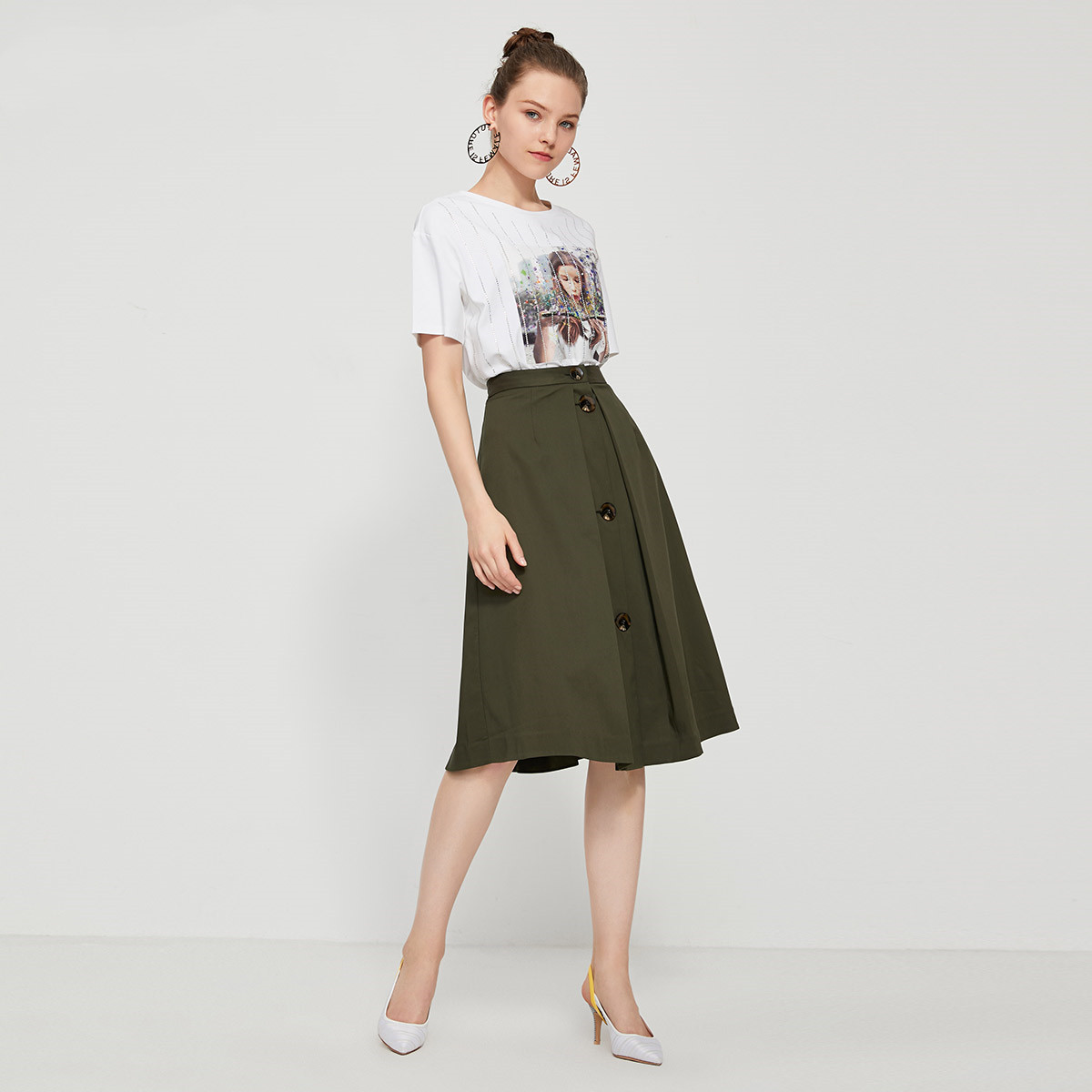 Title 4, Button embellished pleated A-line skirt, a styl...