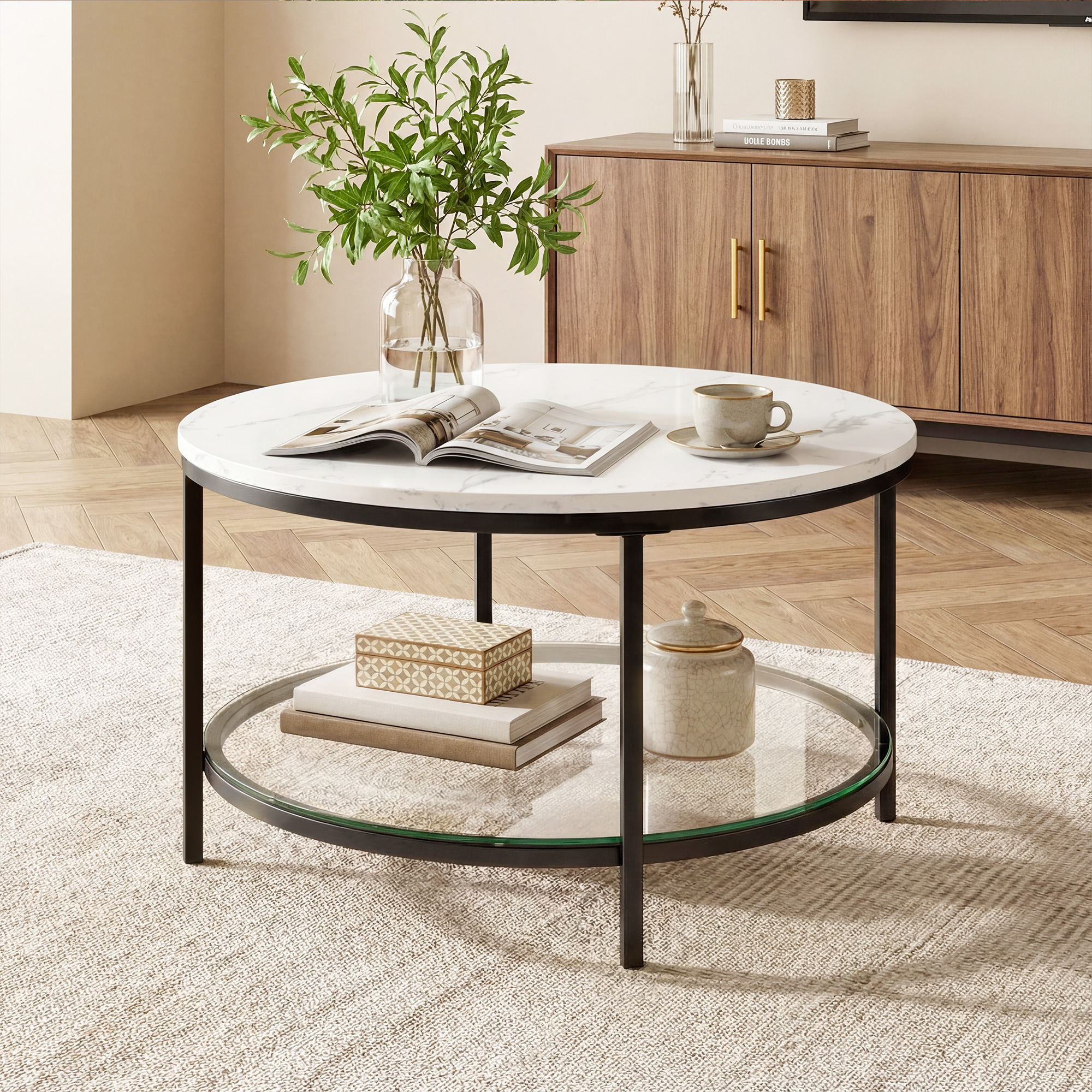 The Living Room Features A Marble Circular Glass Coffee Table, And A Double-layer Circular Transparent Coffee Table With Storage Function.