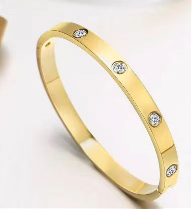 gold-plated-friendship-bracelet-cubic-zirconia-hypo-allergenic-surgical-grade-316L-stainless-steel-love-bright-shiny-smooth-edges-light-heavy-jewelry-box-worn-alone-rings-earrings-charm-inner-circumference-6.7-inches-inner-diameter-2.24-inches-x-1.85-inch