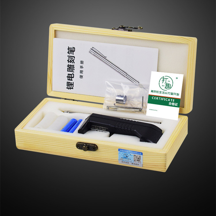 Complete engraving pen kit in wooden storage box, includes stainless steel engraving pen, charger, battery, accessories, instruction manual, and certificate.