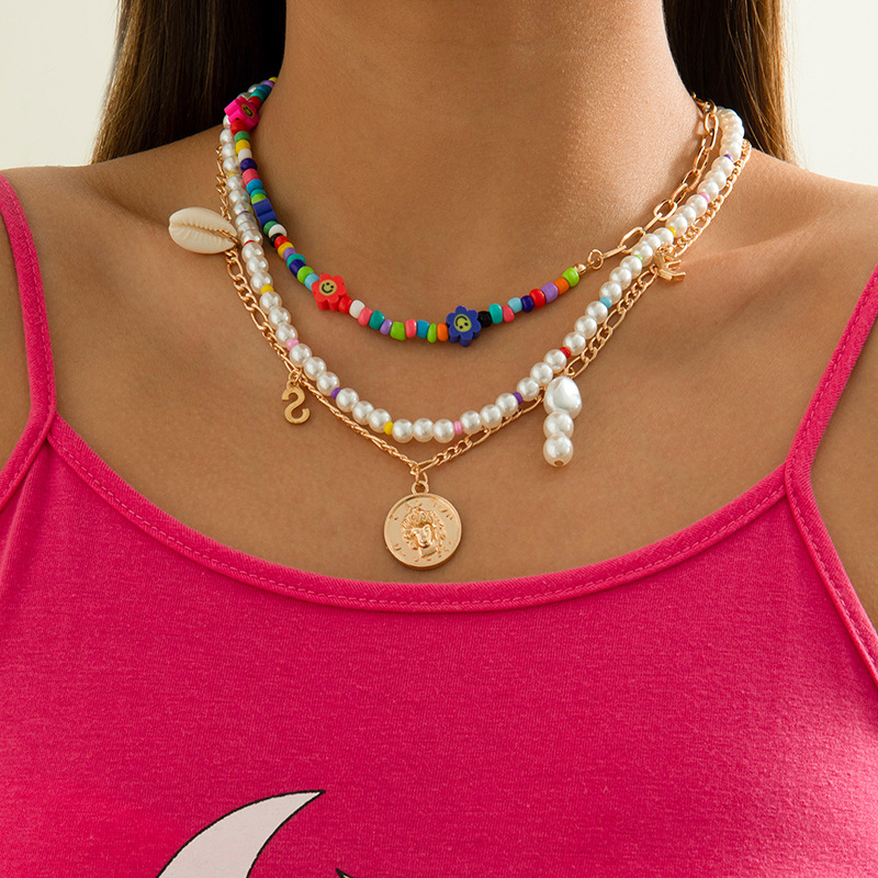 قلادة هندسية نسائية بتصميم لؤلؤ الصدف الصناعي